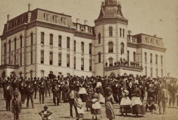 A crowd of African American students on the lawn of Howard University near Miner Hall. Taken between 1867 and 1920. Source: Library of Congress.