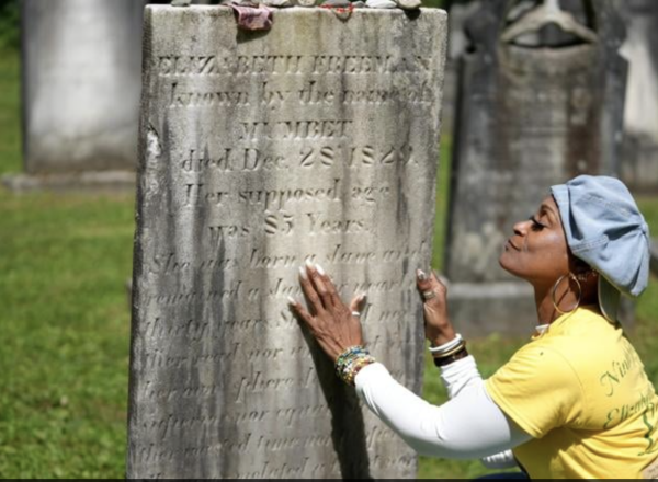 Lisa Shepperson examines Freeman's gravestone, Berkshire Eagle Lisa Shepperson examines Freeman's gravestone, Berkshire Eagle