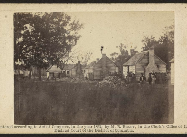African Americans standing next to the slave houses, Port Royal, South Carolina African Americans standing next to the slave houses, Port Royal, South Carolina